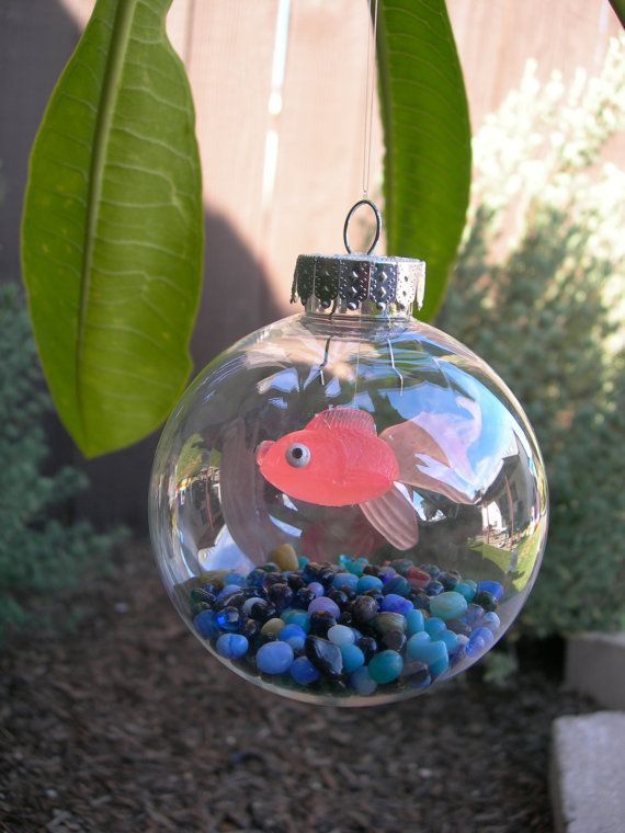Clear ornament with a plastic goldfish inside 