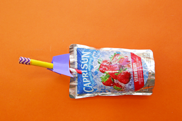 Juice Pouch with a paper rocket at the top 