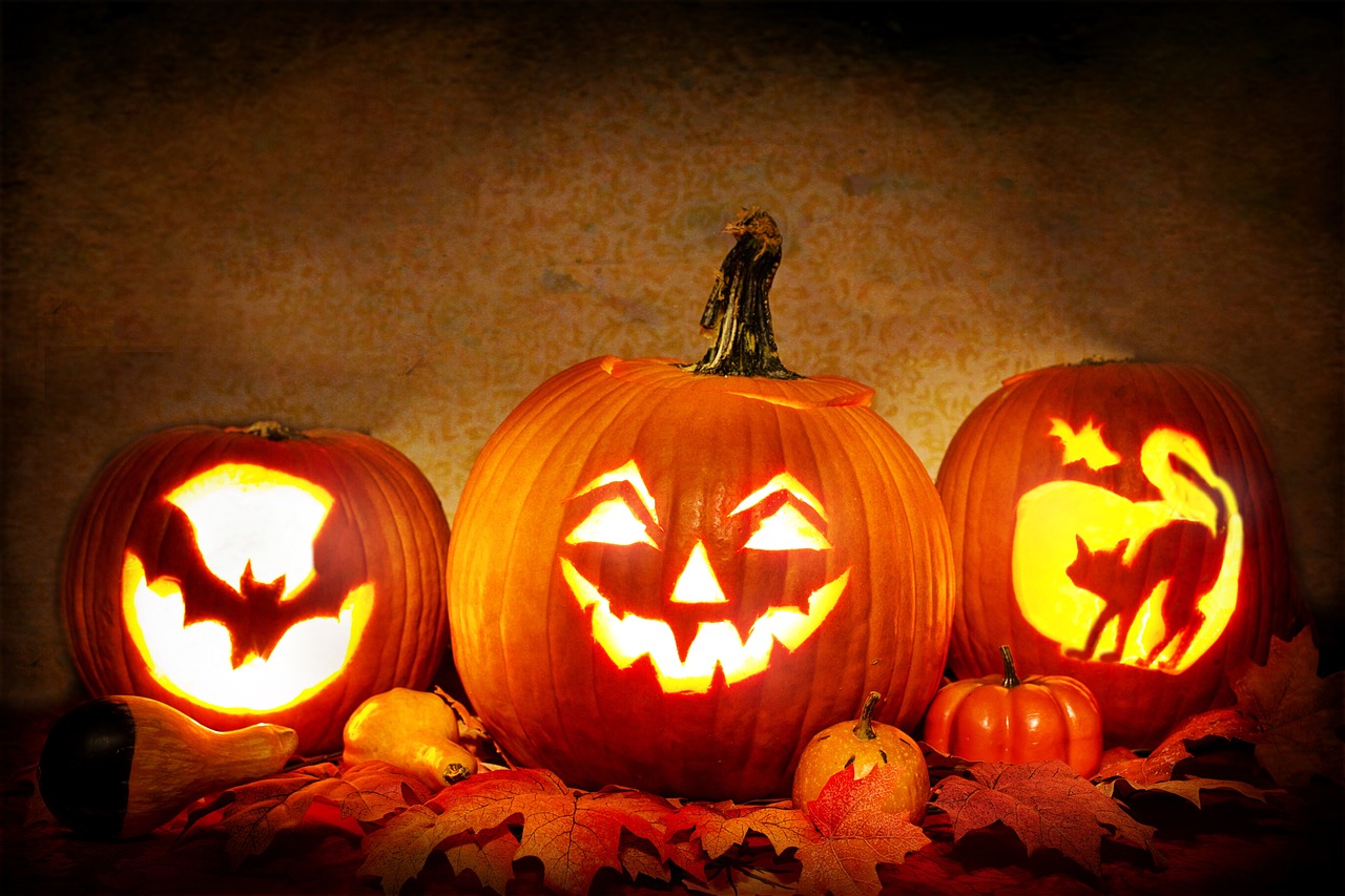 three carved pumpkins