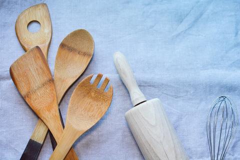 Kitchen spoons, wisk, and roller.