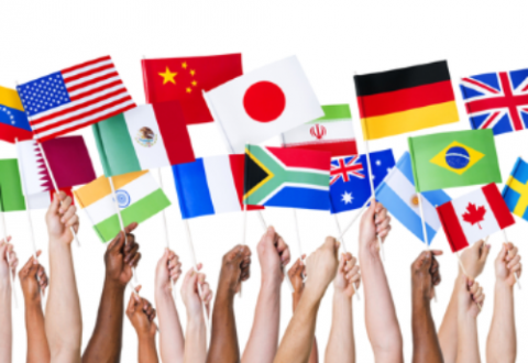 People holding up flags of various countries