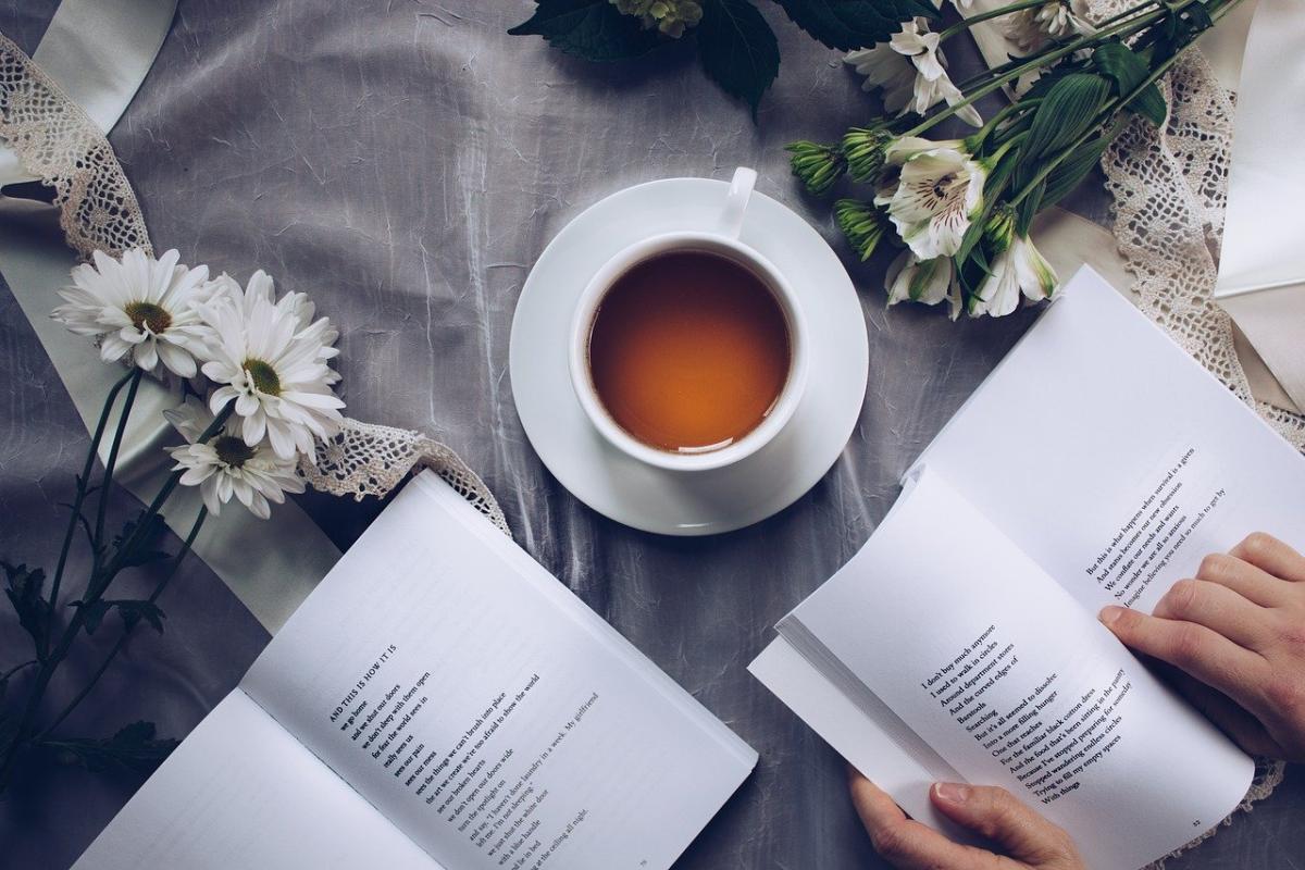 Cup of tea, flowers, and poetry book